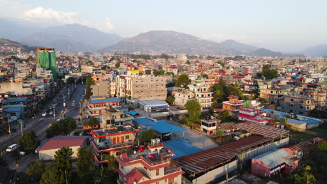 Pokhara,-Nepal---A-Cityscape-Framed-by-the-Majestic-Mountains---Drone-Flying-Forward