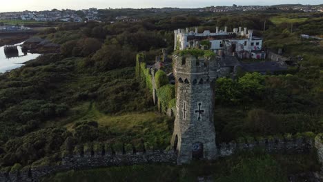 Soldiers-point-house-aerial-view-orbiting-overgrown-abandoned-Holyhead-Victorian-coastal-castle