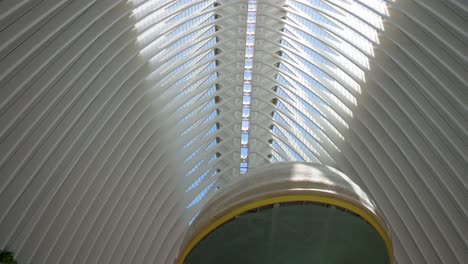 Tilt-down-view-from-within-of-the-Agora-building-as-tourists-visit-the-City-of-Arts-and-Sciences-complex-in-Valencia