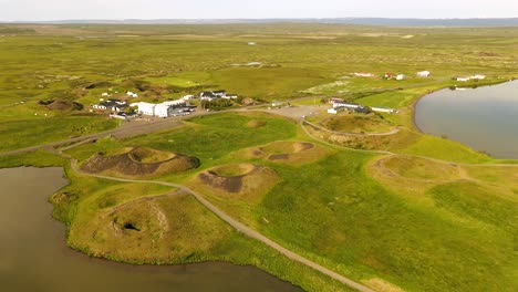 Experience-a-bird’s-eye-view-of-Skútustaðagígar,-showcasing-its-dramatic-craters-and-lush-surroundings,-perfect-for-nature-enthusiasts-and-photographers-alike