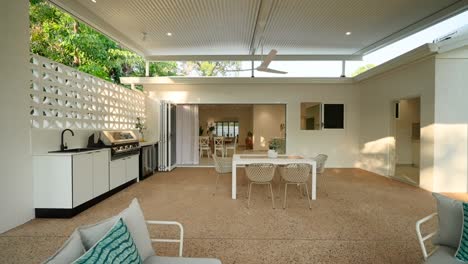 Modern-outdoor-patio-with-sleek-design-and-stylish-furniture,-offering-a-relaxing-space-in-a-luxury-small-home