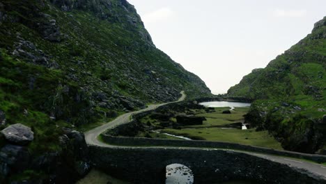 Drone-shot-over-a-bridge-in-McGillycuddy's-Reeks-mountain-range-in-Ireland