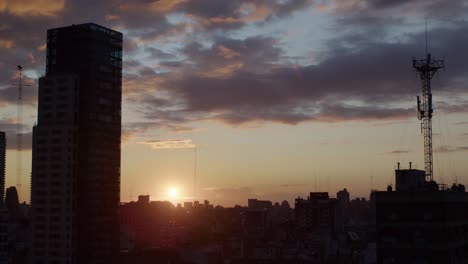 Sunrise-timelapse-over-Buenos-Aires-skyline-with-city-buildings-and-a-tall-radio-tower