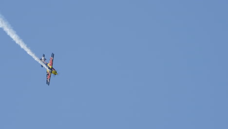 A-Colorful-Red-Bull-Racing-Aircraft-Performs-a-High-Speed-Controlled-diving-roll