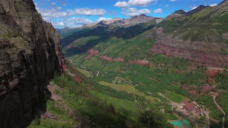 Downtown-Telluride-Colorado-summer-Box-Canyon-Black-Bear-Pass-Road-Bridal-Veil-Falls-aerial-drone-Ouray-Ridgway-Yankee-Boy-Basin-4wd-hiking-bluesky-cliffside-valley-Aspen-Forest-cloud-forward-pan-up