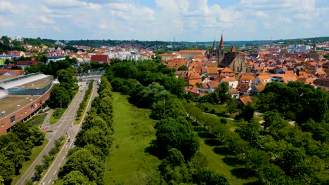 4K-Aerial-Drone-Video-of-Rezatparkplatz-West-Parking-Lot-on-the-Frankische-Rezat-River-in-Ansbach,-Germany