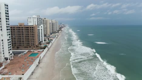 Aerial-rises-from-the-sand-and-waves-of-Daytona-Beach-reveals-city-and-Halifax-River