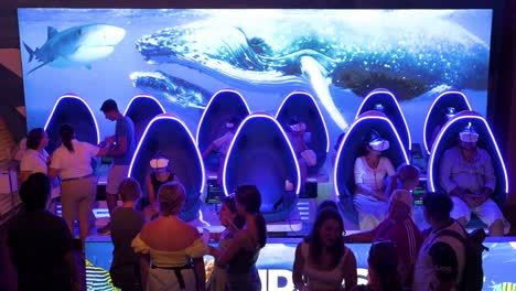 Visitors-use-Virtual-Reality-headsets-at-Oceanografic-in-the-City-of-Arts-and-Sciences-in-Valencia,-Spain