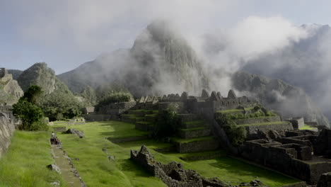 Zoom-out-of-Machu-Picchu-ruins-citadel-with-Huayna-Pichu-mountain-in-background