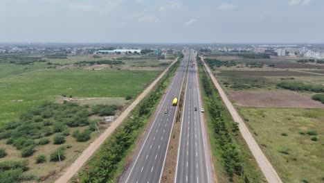 Aerial-shot-of-Hyderabad’s-highway-leading-to-industrial-sector-and-neighboring-greenery