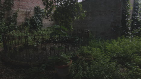 Old-Looking-Garden-Place-In-An-Abandoned-House---Panning-Shot