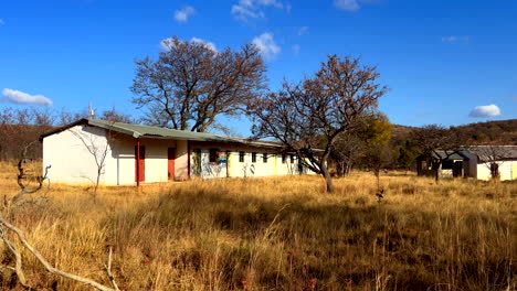 Abandoned-rural-farm-school-in-South-Africa,-nostalgic-reflection-of-past-farming-in-the-area---highlighting-the-decline-and-changing-agricultural-landscape-in-Africa