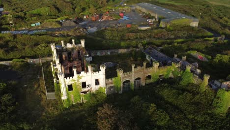 Soldiers-point-house-aerial-view-rising-over-abandoned-ruined-Holyhead-Victorian-estate-mansion