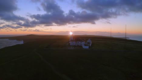 Aerial-pullback-and-ascent-of-lighthouse-beaming-in-beautiful-morning-light