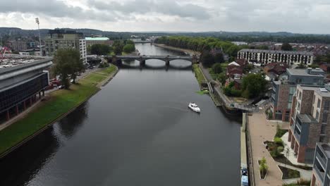 A-Single-river-boat-heading-towards-a-mooring-on-the-River-Trent-in-Nottingham-City-Centre