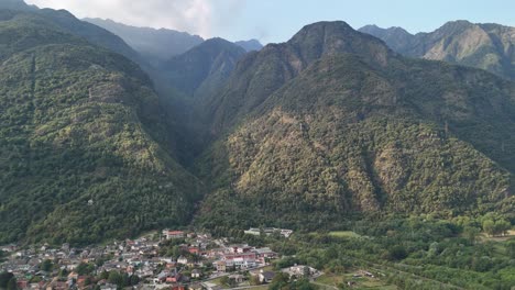 Aerial-view-of-mountains-and-some-city-in-Italy-from-a-drone