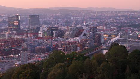 Twilight-aerial-riser-reveal-shot-from-Ekebergparken-of-Nordenga-Bridge-in-Oslo