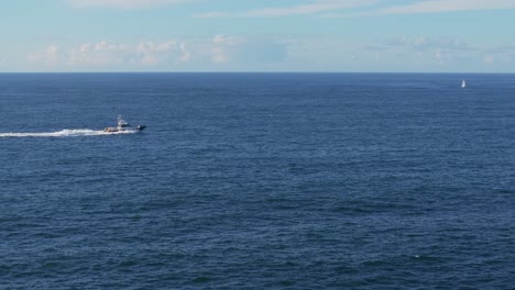 Stunning-View-Of-Boat-Cruising-Across-The-Sea-At-Mera-Beach-In-Galicia,-Spain