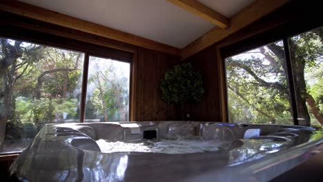 Slow-motion-shot-of-sunlight-lighting-over-a-hot-tub-within-a-villa-in-France