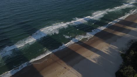 Tall-buildings-shadow-on-the-beach-in-Gold-Coast-Australia-coastal-city