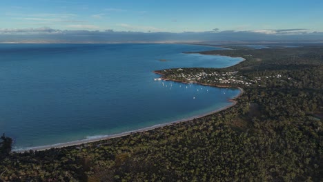 Aerial-view-over-the-Coles-Bay-Conservation-Area-and-Freycinet-town-at-sunset