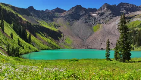 Windy-wildflowers-Lower-Blue-Lake-Mount-Sneffels-Wilderness-beautiful-sunny-morning-Ridgway-Telluride-Colorado-aerial-drone-San-Juan-Rocky-Mountains-Dallas-Range-blue-sky-hiking-trails-circle-left