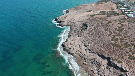 The-rocky-north-cyprus-coast-with-turquoise-waters-and-rugged-landscape,-aerial-view