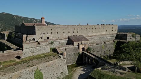 Taking-flight-from-Fort-de-Bellegarde-in-Le-Perthus,-Languedoc-Rousillon,-France