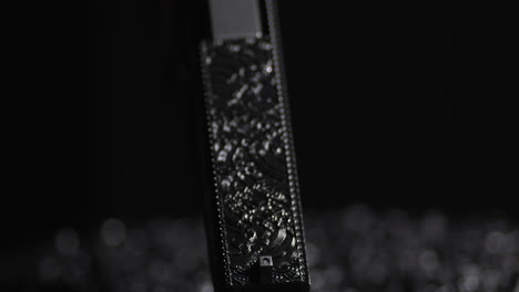 Detail-Of-A-Laser-Engraved-Handgun-With-A-Black-Backdrop