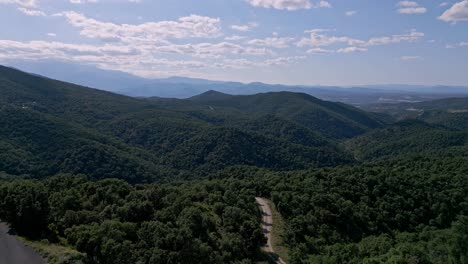 Road-passing-through-mountain-forest-near-Le-Perthus,-France