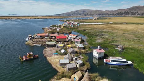 Flyover-unique-off-grid-floating-Uros-Islands-in-Lake-Titicaca,-Peru