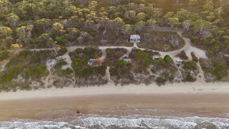 Campground-seafront-at-sunset,-Coles-Bay-in-Tasmania,-Australia