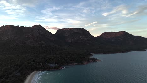 Aerial-view-over-the-mountains-of-Coles-Bay-at-sunset