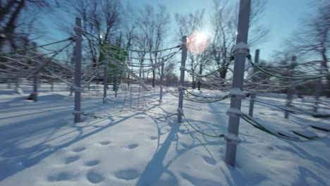 Fpv-shot-various-obstacles-in-the-playground-during-winter-in-Montreal,-Canada