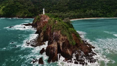 Aerial-Shot-Moving-Out-to-Ocean-from-Island-Lighthouse