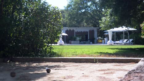 Slow-motion-shot-of-bowls-hitting-off-of-each-other-in-a-garden