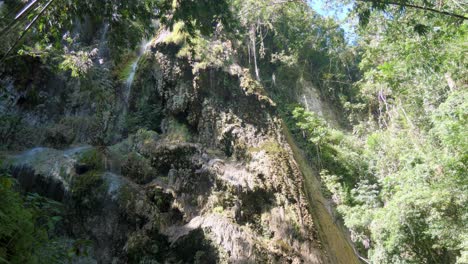 Tumalog-Falls-water-cascading-down-a-mossy-cliff-in-Cebu,-Philippines