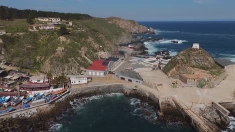 Aerial-View-of-Quintay-Museum-Foundation,-Ex-Ballenera-Museum,-set-against-the-rugged-Chilean-coastline-in-Valparaíso,-Chile