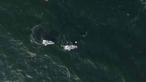 Sailboats-steering-and-turning-during-yacht-race,-sail-movement-aerial-top-down