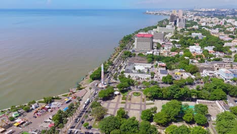 Distant-drone-shot-of-seafront-George-Washington-Avenue-in-Dominican-Republic