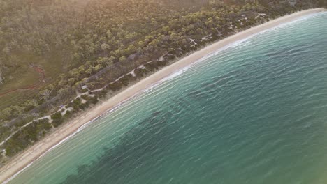 Top-down-view-over-the-Coles-Bay-beach-and-blue-waters-in-Tasmania