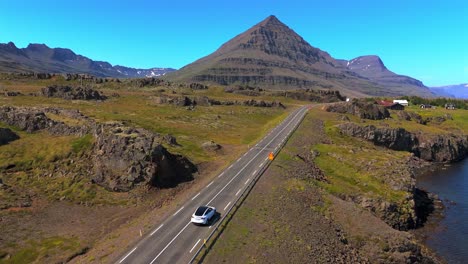 This-drone-video-showcases-the-diverse-ecosystems-of-Djúpivogur,-highlighting-the-lush-valleys-and-rocky-peaks-that-make-Iceland-truly-unique