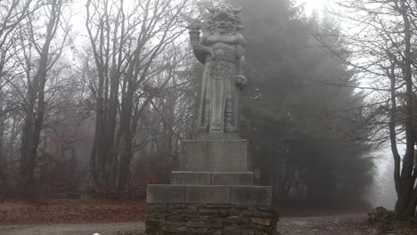 Explore-the-mystical-charm-of-the-"Old-Statue-of-Radegast-in-the-Forest-in-Czech-Republic"-footage,-showcasing-an-ancient-Slavic-god-amidst-a-lush,-secluded-woodland