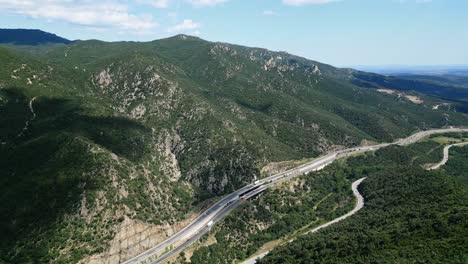 Drone-Panoramic-Landscape-of-Mediterranean-Highway-France-Spain-Borders-Daylight-around-green-hills,-Aerial-View