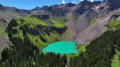 Sunny-morning-summer-hiking-trail-Lower-Blue-Lake-Mount-Sneffels-Wilderness-Ridgway-Telluride-Colorado-aerial-drone-San-Juan-Rocky-Mountains-Uncompahgre-National-Forest-blue-sky-forward-pan-up-motion