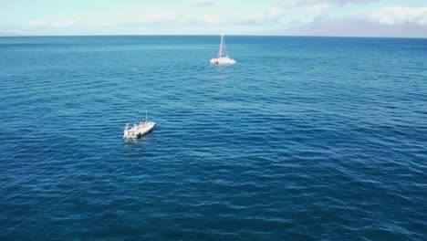Flying-by-two-boats-in-the-ocean