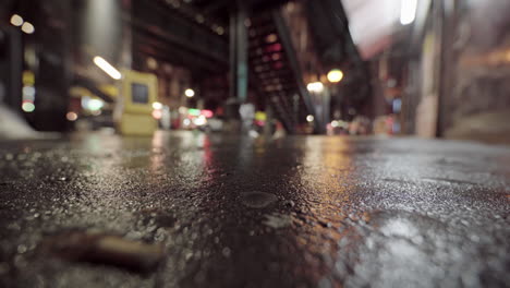 Out-Of-Focus-Dystopian-Street-With-Focus-on-Asphalt,-Night