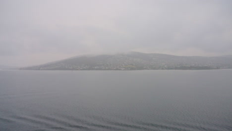 Overcast-Foggy-Hobart-Mountain-Skyline-From-Ocean-Entry,-4K-Slow-Motion