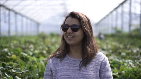 Portrait-Of-A-South-Asian-Tourist-Wearing-Sunglasses-In-A-Fruit-Farm