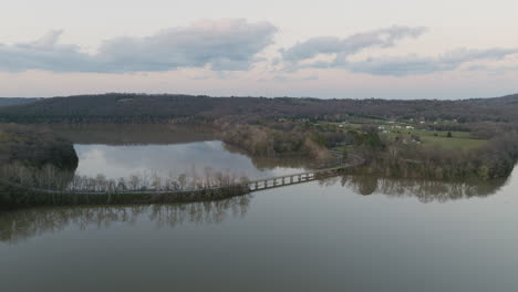 Revealing-shot-of-a-bridge-over-the-shore-of-Lake-Sequoyah-connecting-both-sides